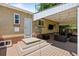 Backyard patio with outdoor seating and string lights attached to the house at 2582 S Uno Way, Denver, CO 80219