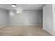 Unfinished basement includes a carpeted area, a window for natural light, and closet space at 2582 S Uno Way, Denver, CO 80219