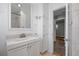 Updated bathroom with a white vanity, and walk-in shower at 2582 S Uno Way, Denver, CO 80219