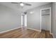 Bedroom featuring a ceiling fan, gray walls, and wood-look floors at 2582 S Uno Way, Denver, CO 80219