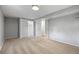 Bedroom includes neutral walls, carpet, and an open closet at 2582 S Uno Way, Denver, CO 80219