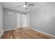 Bedroom featuring a ceiling fan, gray walls, and wood-look floors at 2582 S Uno Way, Denver, CO 80219