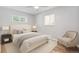 Neutral bedroom features new carpet, ceiling fan, and lots of natural light at 2582 S Uno Way, Denver, CO 80219