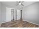 Bedroom featuring a ceiling fan, gray walls, and wood-look floors at 2582 S Uno Way, Denver, CO 80219