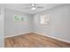 Bedroom with neutral walls, ceiling fan, and wood-look floors at 2582 S Uno Way, Denver, CO 80219