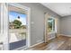 Inviting foyer features wood-look flooring, a window for natural light, and neutral paint at 2582 S Uno Way, Denver, CO 80219