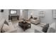 Living room featuring modern furnishings, carpet, and a foosball table at 2582 S Uno Way, Denver, CO 80219