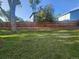 Fenced backyard with grass and mature shade tree at 6207 W 92Nd Pl, Westminster, CO 80031