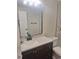 Nicely updated bathroom featuring a stylish vanity, modern faucet, and framed mirror at 6207 W 92Nd Pl, Westminster, CO 80031