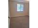 Cozy bedroom featuring neutral walls, carpet, and a window for natural light at 6207 W 92Nd Pl, Westminster, CO 80031