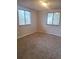 Sunlit bedroom featuring neutral walls, carpeting, and two windows for natural light at 6207 W 92Nd Pl, Westminster, CO 80031