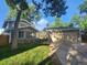 Charming home featuring a lush lawn, mature trees, and a detached two-car garage at 6207 W 92Nd Pl, Westminster, CO 80031