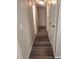 Hallway with wood floor, doors, and neutral colored walls at 6207 W 92Nd Pl, Westminster, CO 80031