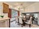 Elegant dining area with a stylish chandelier and comfortable seating for Gathering gatherings at 12021 Dahlia Dr, Thornton, CO 80241