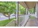 Cozy front porch view with white railings, perfect for relaxing and enjoying the neighborhood at 12021 Dahlia Dr, Thornton, CO 80241