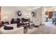 Well-appointed living room with neutral tones, comfortable seating, and stylish decor at 12021 Dahlia Dr, Thornton, CO 80241