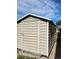 Exterior view of the storage shed with a metal door at 12021 Dahlia Dr, Thornton, CO 80241