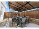 The covered back patio offers great privacy and shade during the day and lovely lighting at night at 1535 Spruce St, Denver, CO 80220