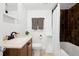 Modern bathroom featuring a tiled shower and dark wood cabinet at 1535 Spruce St, Denver, CO 80220
