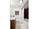 Modern bathroom featuring a tiled shower and dark wood cabinet at 1535 Spruce St, Denver, CO 80220