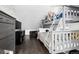 Comfortable bedroom with a bunk bed, hardwood floors, and gray furniture set at 1535 Spruce St, Denver, CO 80220