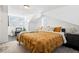 Well-lit bedroom featuring a queen bed, area rug, two windows, and modern decor at 1535 Spruce St, Denver, CO 80220