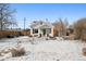 Charming home with a snow-covered front yard at 1535 Spruce St, Denver, CO 80220
