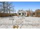 Charming home with a white picket fence and snow-covered yard at 1535 Spruce St, Denver, CO 80220