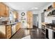 Bright kitchen with light wood cabinets, stainless steel appliances, and ample counter space, perfect for meal preparation at 1535 Spruce St, Denver, CO 80220