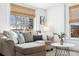 Cozy living room with a comfortable sectional, throw pillows, and natural light at 1535 Spruce St, Denver, CO 80220