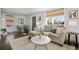 Living room featuring a comfortable sofa, natural light, and stylish decor at 1535 Spruce St, Denver, CO 80220