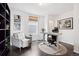 Office space with modern desk, chair, and dark hardwood floors at 1535 Spruce St, Denver, CO 80220