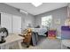 Bright bedroom with a desk, ample storage, and a view of the outdoors, creating a comfortable and functional space at 8885 W 64Th Pl, Arvada, CO 80004