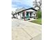 Attractive single-story home with a welcoming porch and a long driveway, set on a sunny day at 8885 W 64Th Pl, Arvada, CO 80004