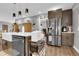 Spacious kitchen with a large island, stainless steel appliances, and ample storage at 8885 W 64Th Pl, Arvada, CO 80004