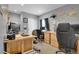 Functional home office with multiple workstations and ample natural light at 8885 W 64Th Pl, Arvada, CO 80004