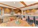 Well-appointed kitchen featuring wood cabinetry, granite counters, and stainless steel appliances at 2929 Highlands View Rd, Evergreen, CO 80439