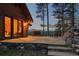 Charming outdoor patio with stone flooring, seating area, and picturesque mountain views at 2929 Highlands View Rd, Evergreen, CO 80439