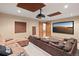 Comfortable theater room with plush seating, projector and large screen for movie nights at 2929 Highlands View Rd, Evergreen, CO 80439