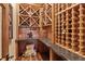 This stunning wine cellar has a custom wine rack, countertop and wine glass storage at 2929 Highlands View Rd, Evergreen, CO 80439