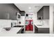 A modern kitchen featuring laundry area and stainless steel appliances and fixtures at 5955 E 10Th Ave # 507, Denver, CO 80220