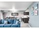 Combined living and dining area with a modern kitchen in the background at 5955 E 10Th Ave # 507, Denver, CO 80220