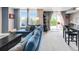 Open-concept layout with a cozy seating area and balcony access at 5955 E 10Th Ave # 507, Denver, CO 80220