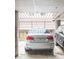 Assigned parking spot in a covered garage with a silver sedan at 5955 E 10Th Ave # 507, Denver, CO 80220