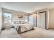 Large primary bedroom with plush carpet, two windows and ample closet space at 4272 E 126Th Pl, Thornton, CO 80241