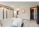 Primary bedroom featuring closet space and a pass through to the kitchen at 4272 E 126Th Pl, Thornton, CO 80241