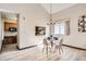 Dining room featuring a chandelier and window overlooking a kitchen passthrough for easy serving at 4272 E 126Th Pl, Thornton, CO 80241
