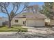 Inviting home featuring a well-maintained lawn, attached two-car garage, and an attractive exterior at 4272 E 126Th Pl, Thornton, CO 80241