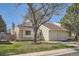 Charming home with a two-car garage, manicured lawn, and mature landscaping at 4272 E 126Th Pl, Thornton, CO 80241