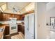 Kitchen with ample counter space, bright white appliances, and a convenient access to the living room at 4272 E 126Th Pl, Thornton, CO 80241